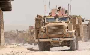 A Mastiff 2 heavily armoured, 6x6 wheel-drive patrol vehicle provides force protection for a 116-vehicle convoy during a perilo