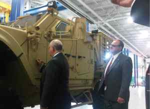 U.S. Army Under Secretary Dr. Joseph Westphal signs an M-ATV during his visit to Oshkosh Defenses Wisconsin campus